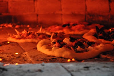 pizza made in an old sicilian oven